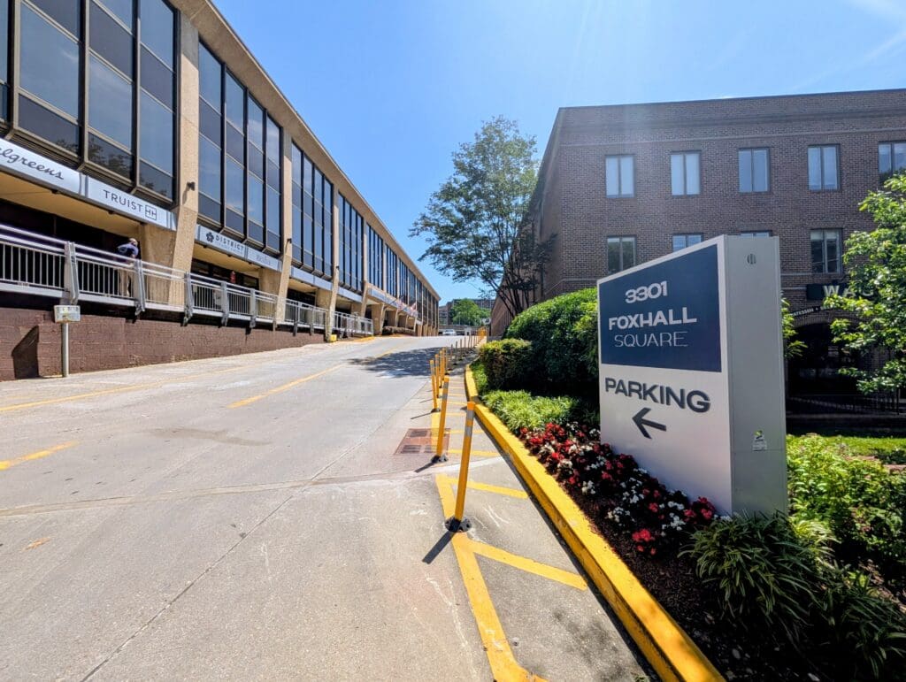 3301 Foxhall Square parking entrance sign on the south side of the building